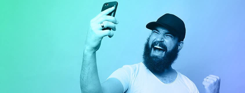 Man celebrating his mobile marketing victory